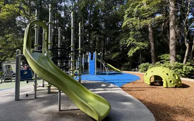 Playground at Lake Crabtree County Park in Raleigh surrounded by trees and nature